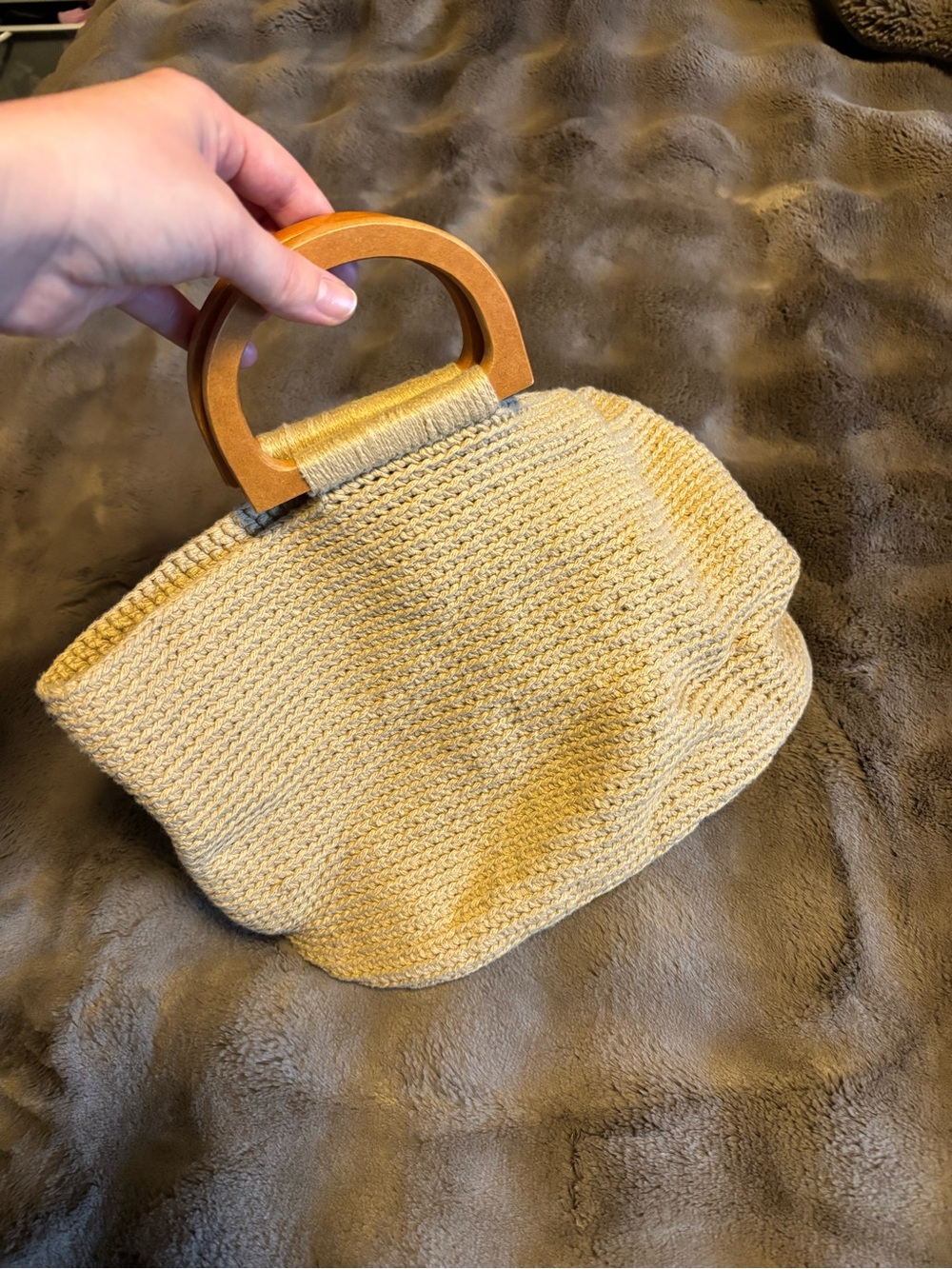 Woven straw handbag with wooden handles